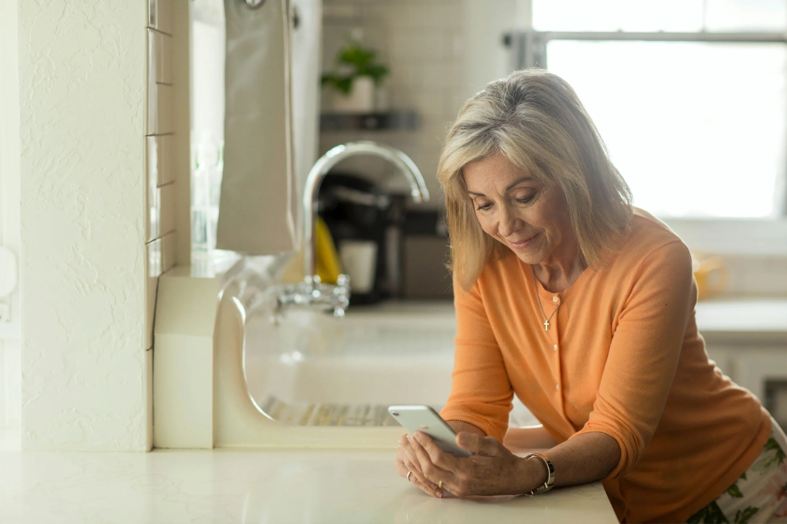 A patient consulting with their physician over video from home